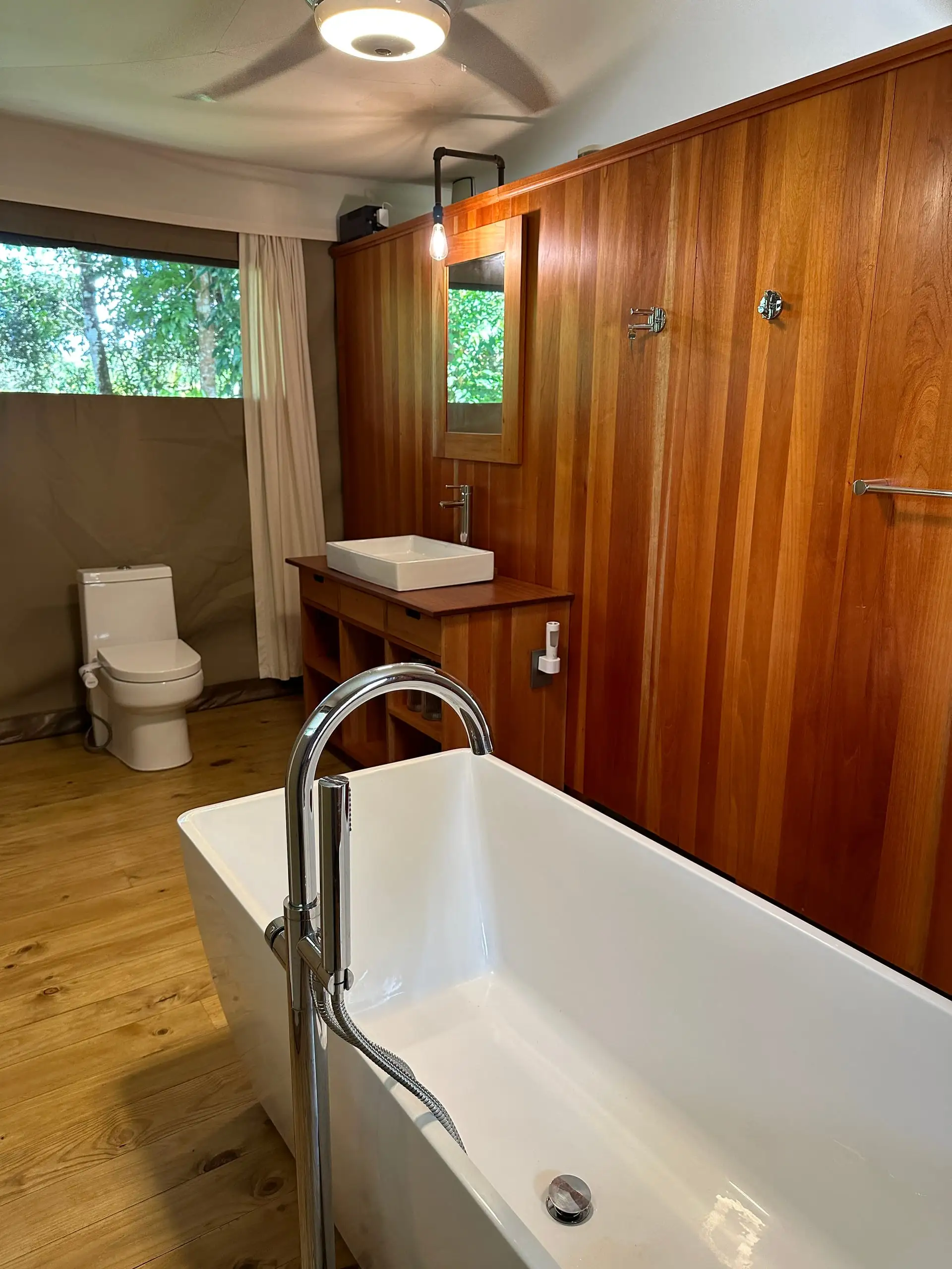 The basin and mirror in the bathroom