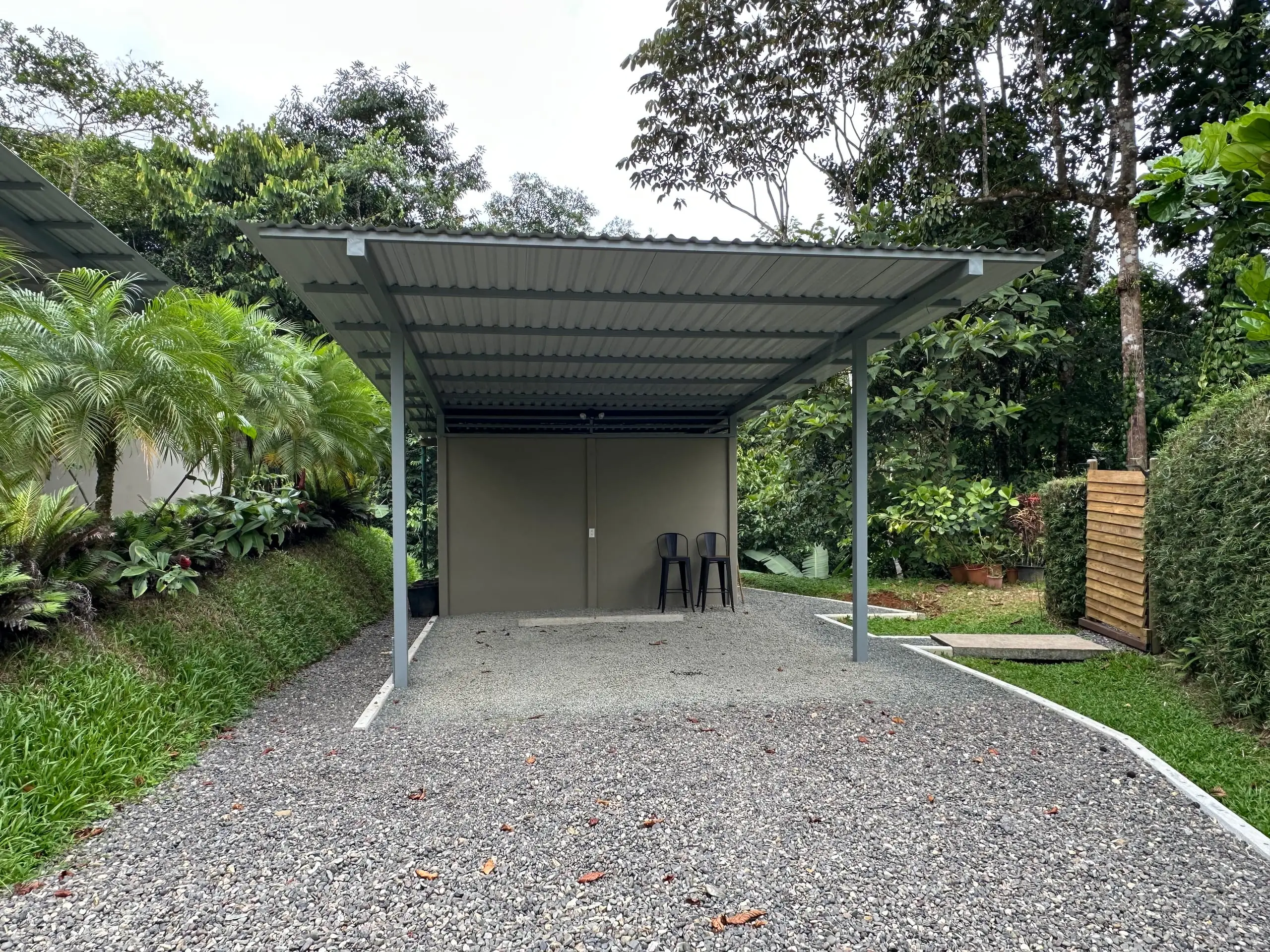 The covered carport and the drive in