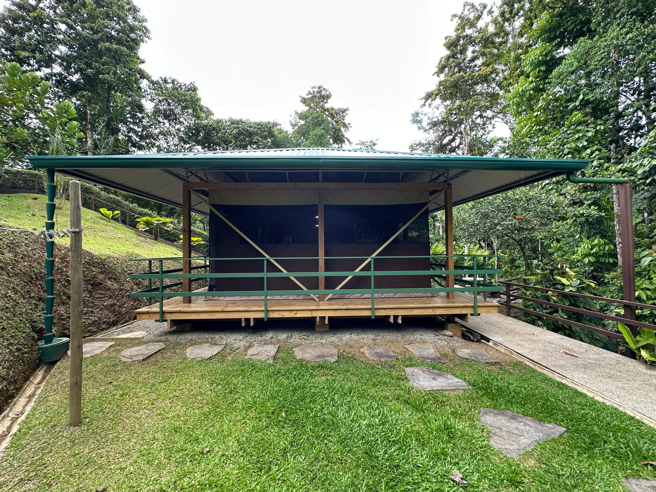 The tent square on, deck and railings across the front