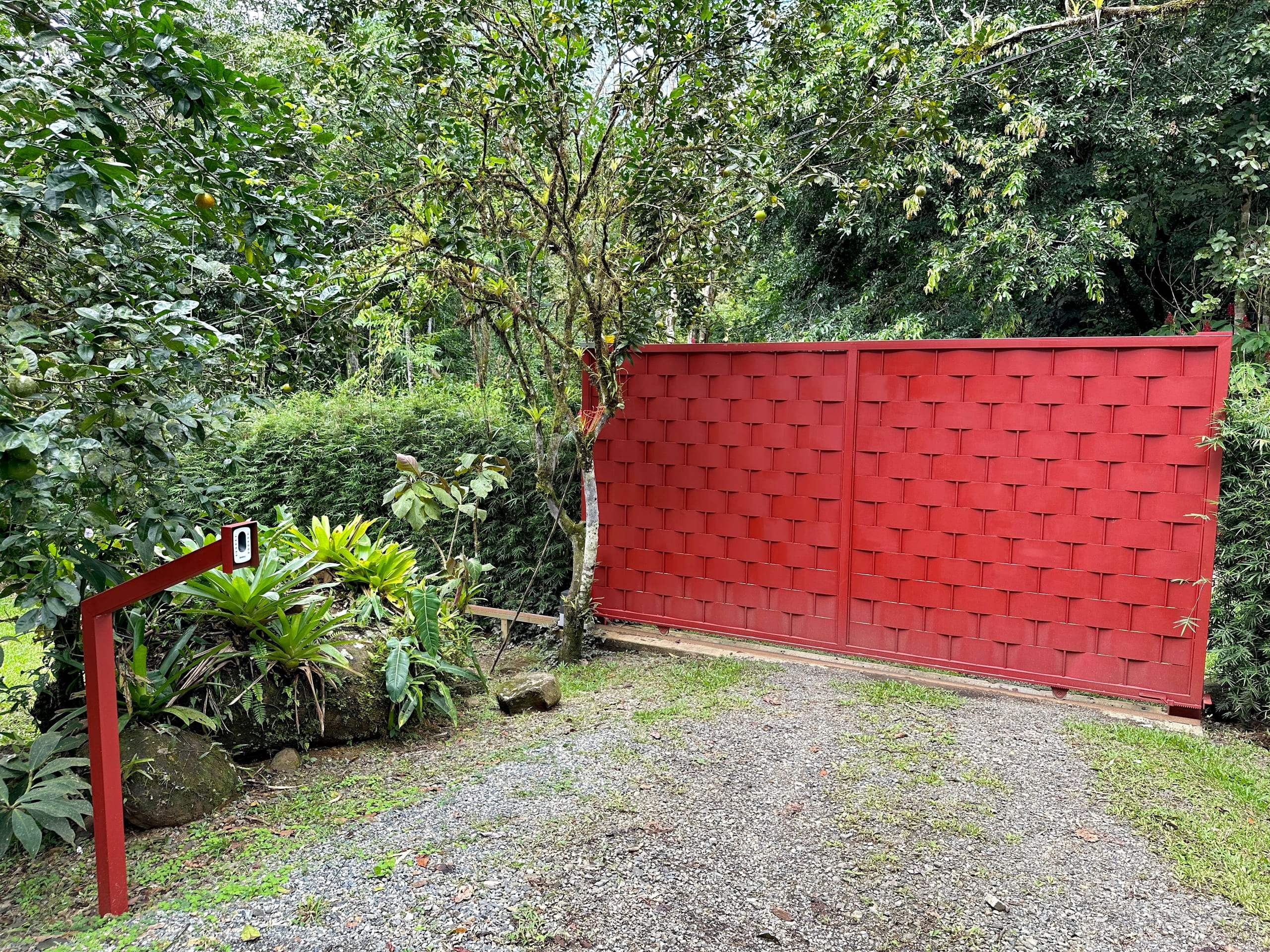 The red gate at the entrance to the finca