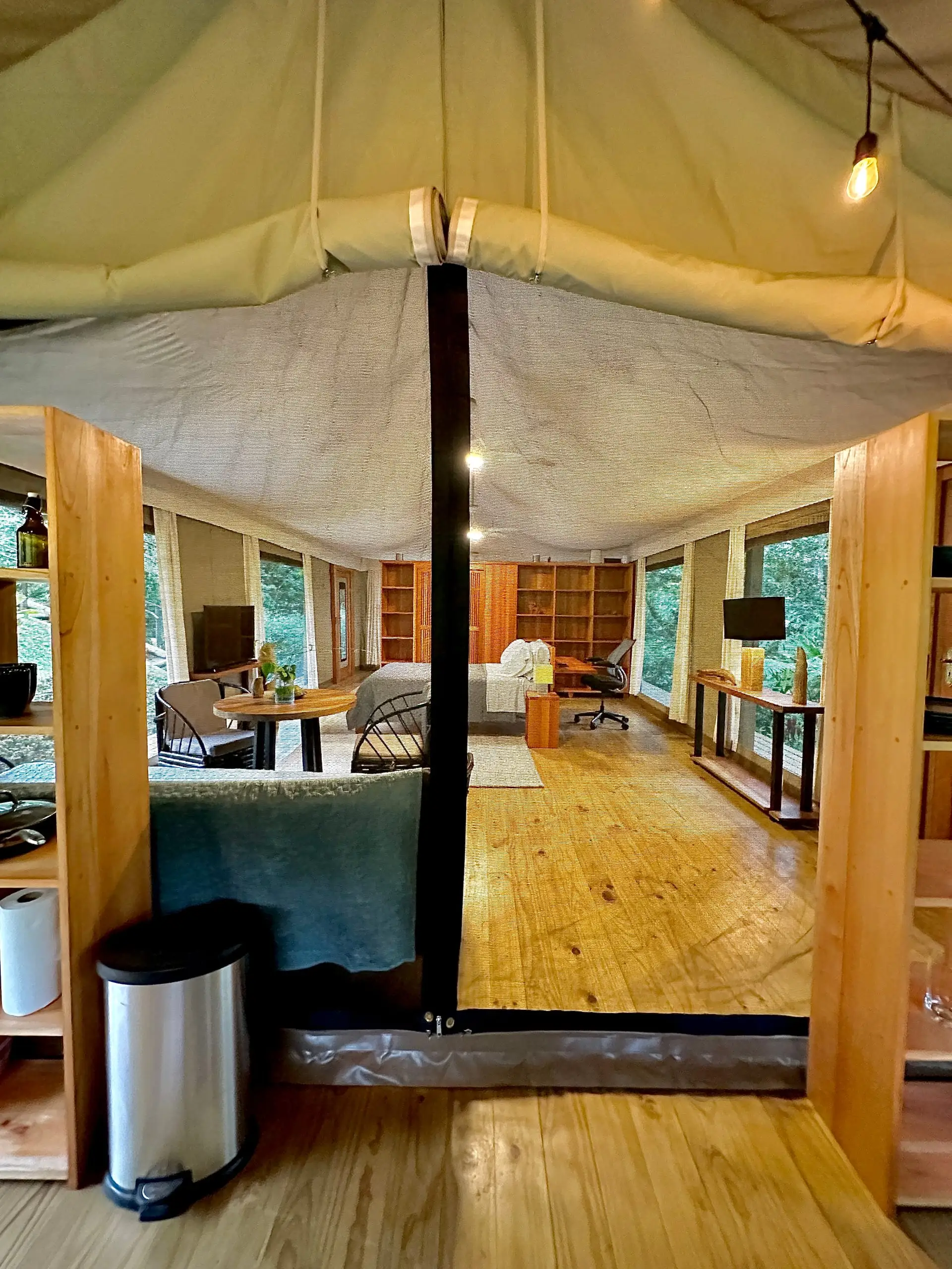The full span of the interior beneath the tensioned canvas roof