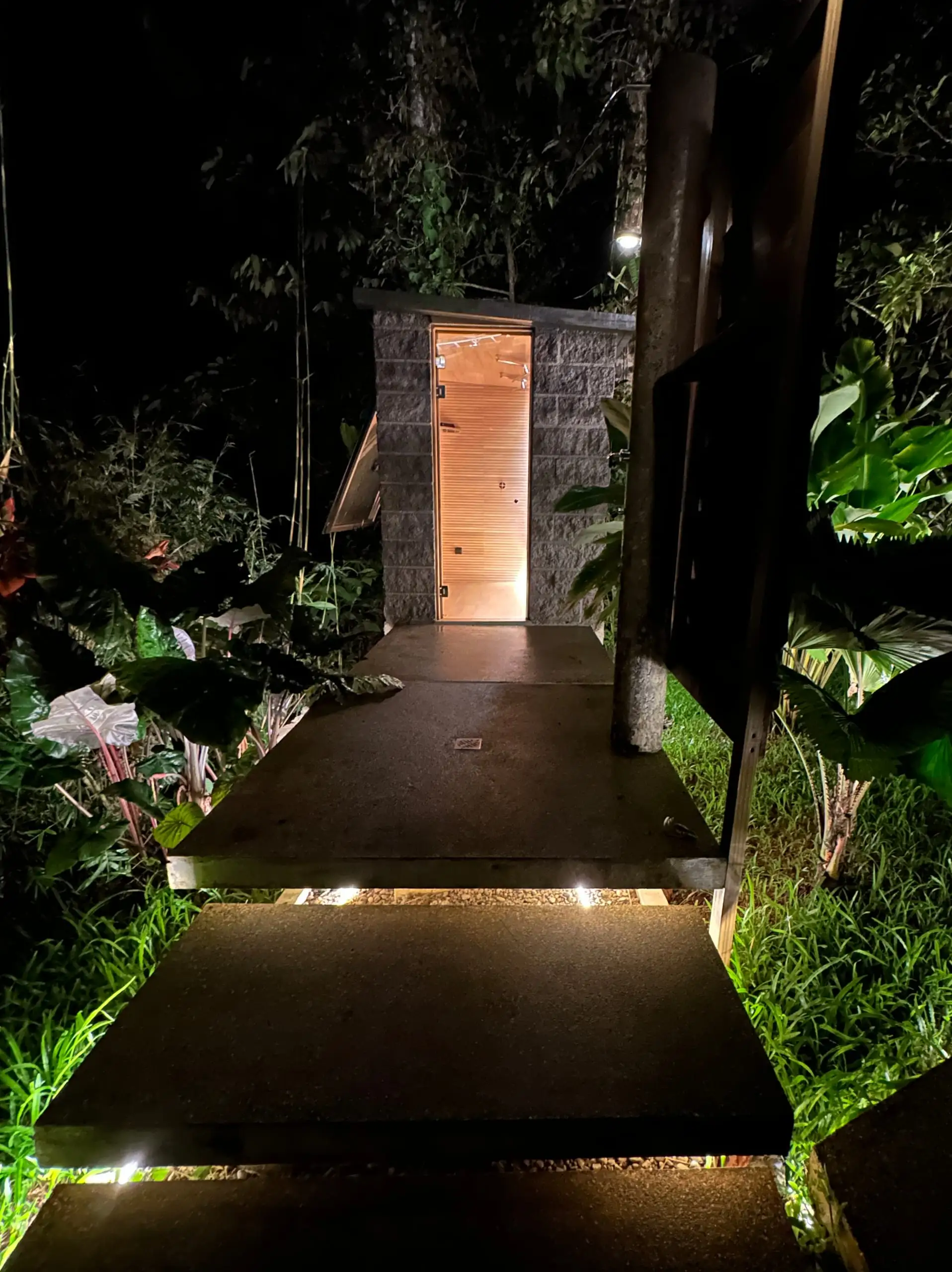 The lit path leading to the steam room after dark