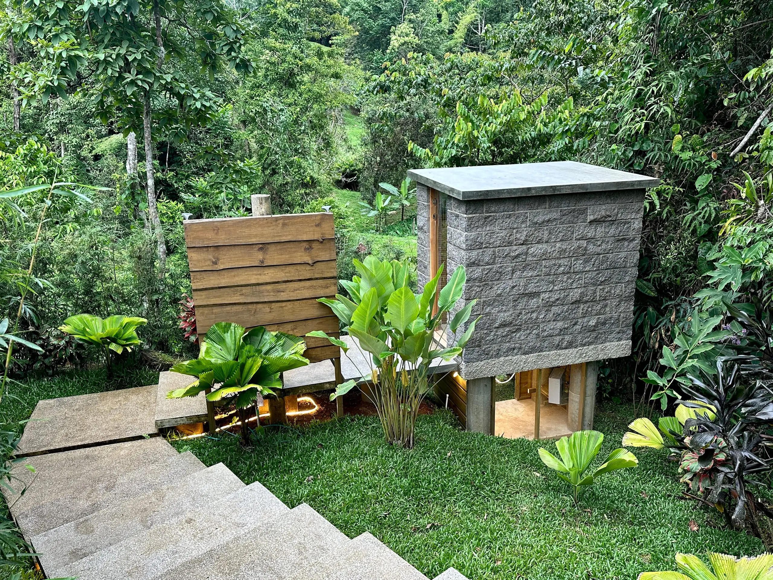 The outdoor shower beside the steam room, behind its timber privacy screen